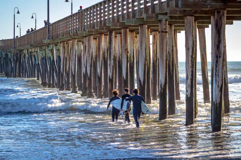 Cayucos pier and surfers