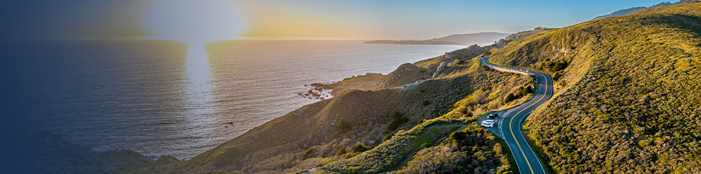 34392 Highway 1 winding through a hilly, coastal countryside