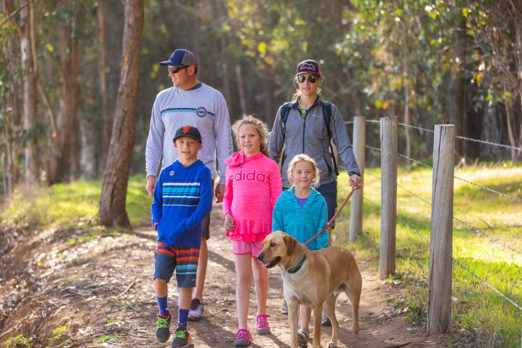 Hiking family with dog