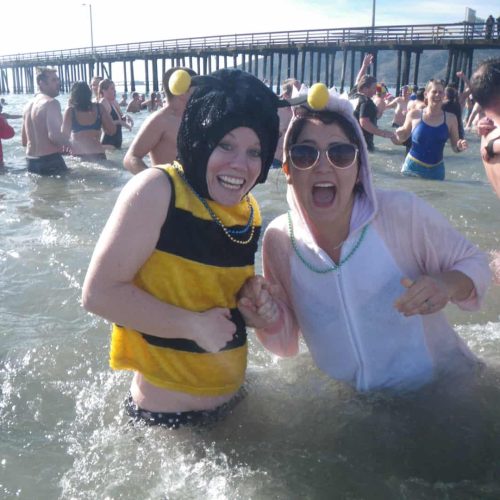 Two women, one dressed as a bee Two women, one dressed as a bee